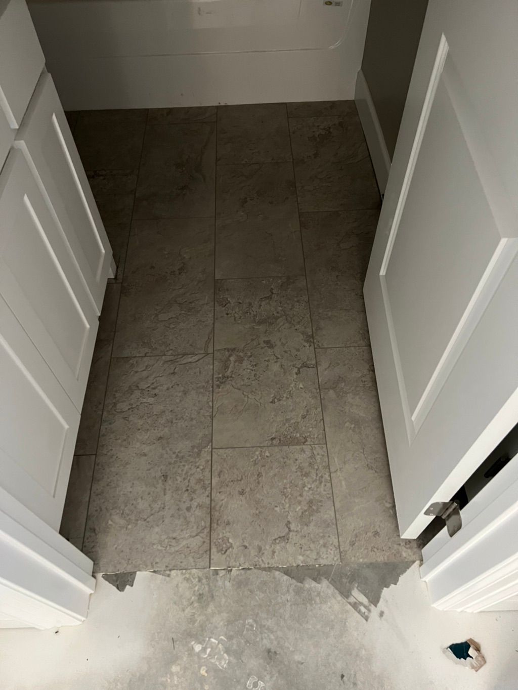 Vinyl plank in a tile form. Very convenient if you