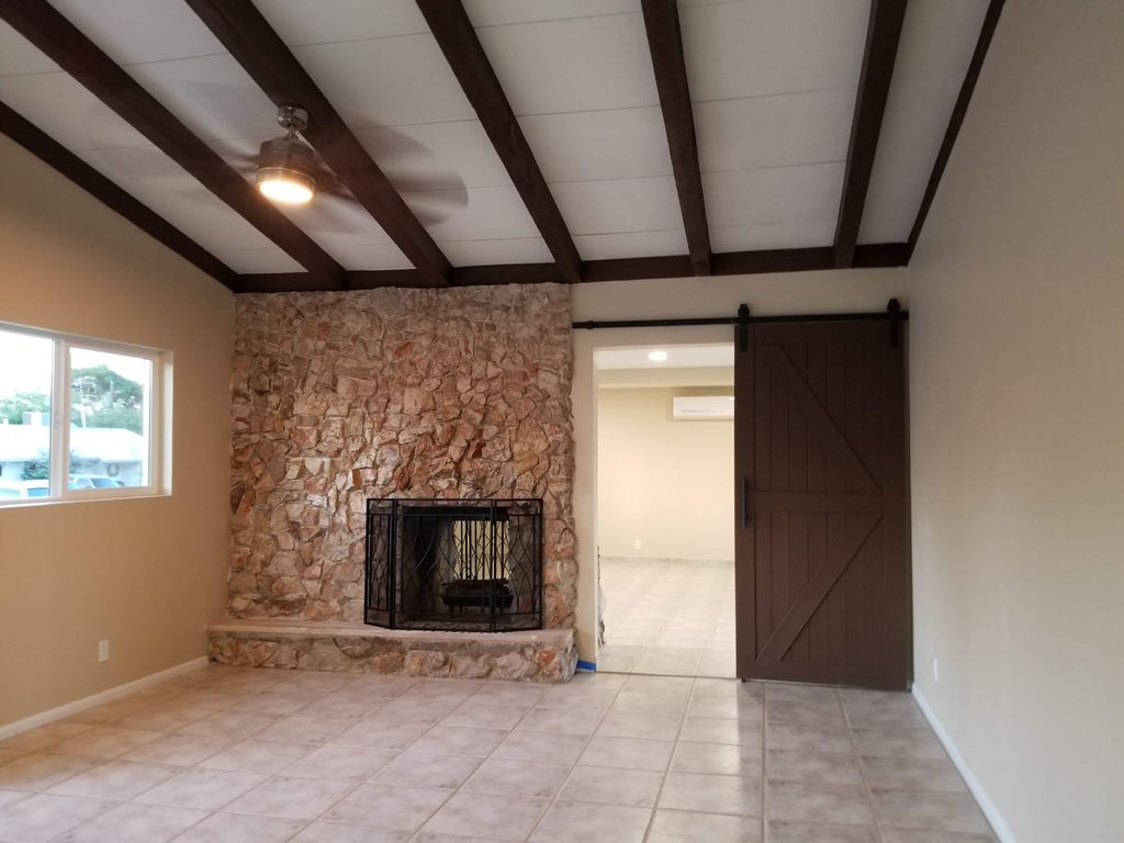 faux beam built to hide all wiring from new fan in