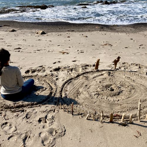 Holding space for a healing ritual on the beach.