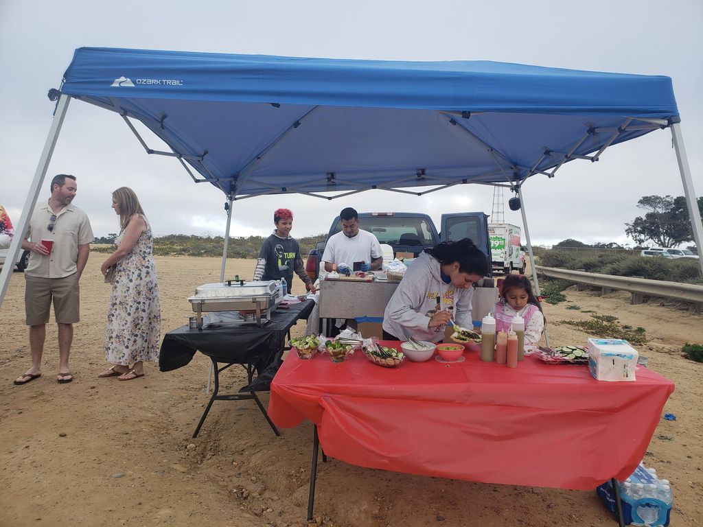 set up for a birthday aparty at the beach. 