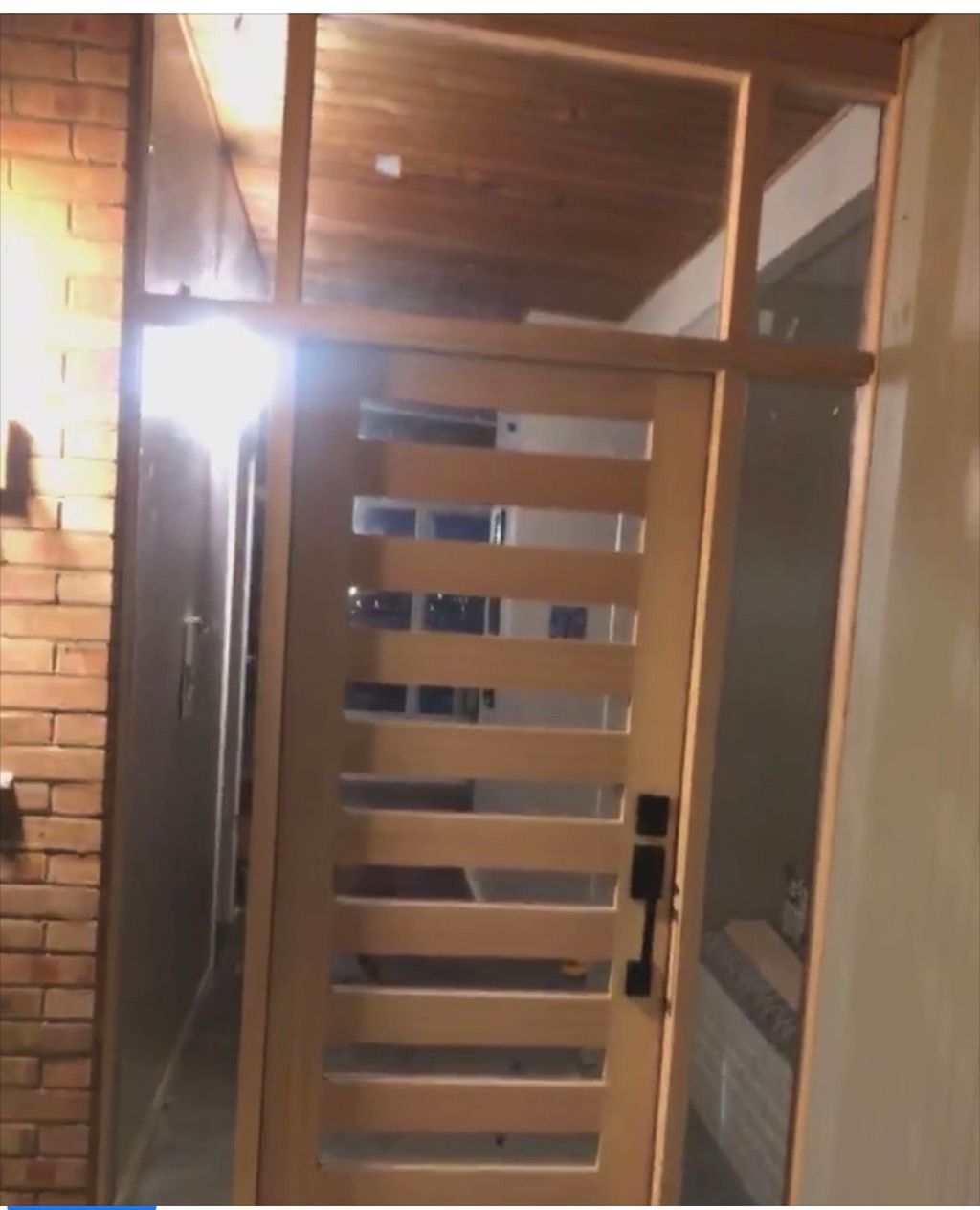 Before single exterior door with two side lights a