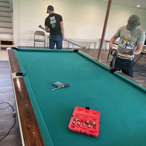 Final Assembly of pool table, perfectly level