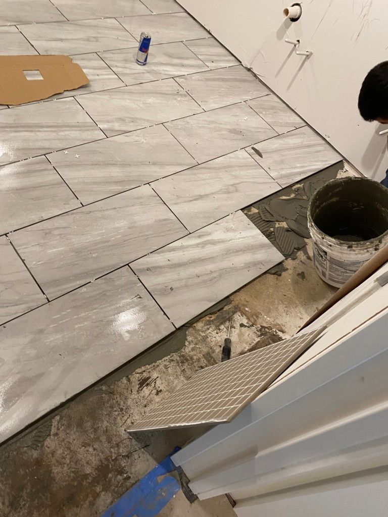 Installing tile flooring in bathroom