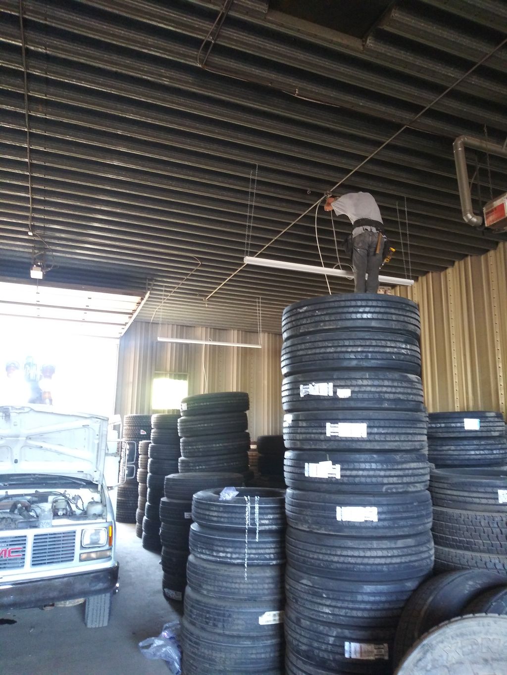 there is a ladder on the other side of the tires .