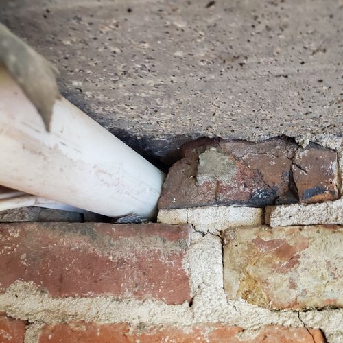 Hole drilled into brick face and not sealed proper