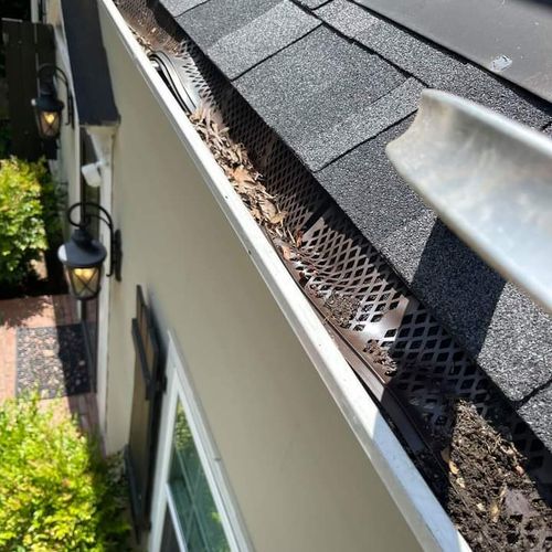 This is a plastic gutter guard sold at big box sto