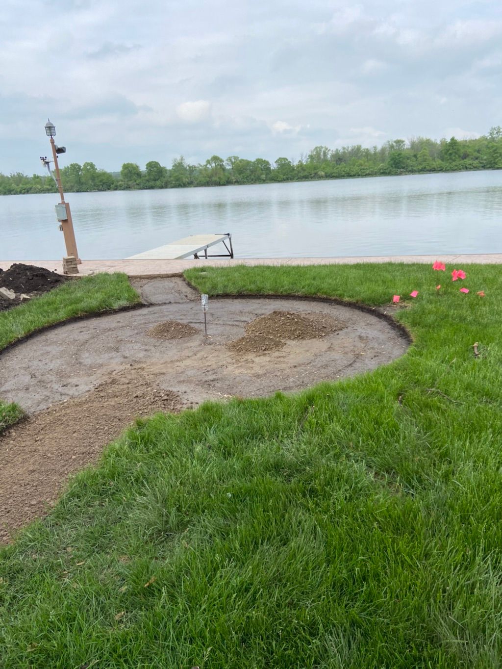 Outlining and leveling new fire pit and walkway 