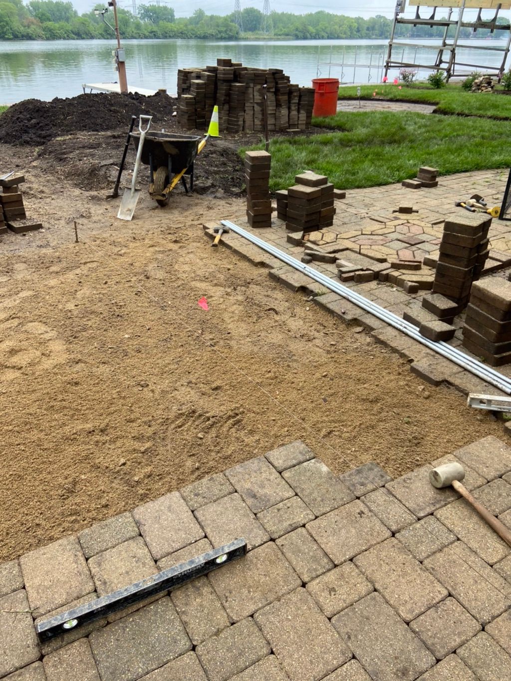 Remove old pavers to relocate 