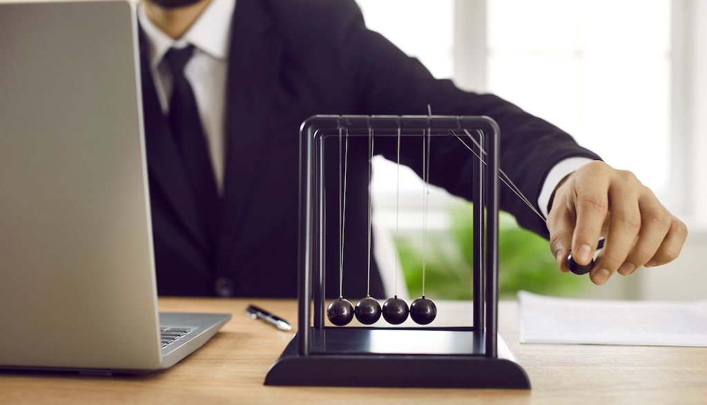 newton's cradle on office desk