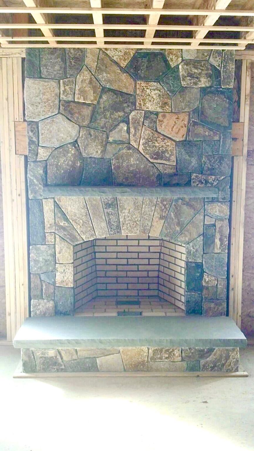 Michael built this stone veneer fireplace.  His pr