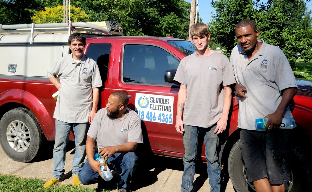 Our team trying on their brand new shirts.