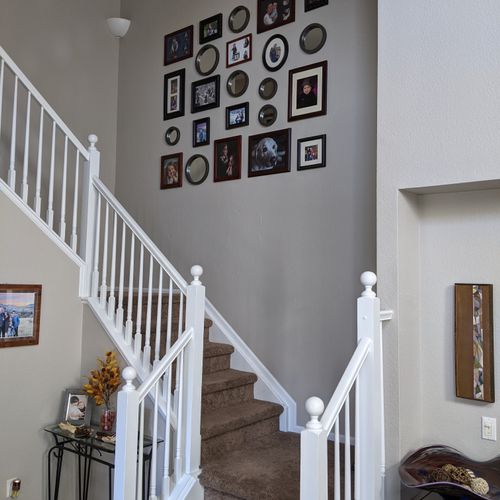 Collage wall on stairs