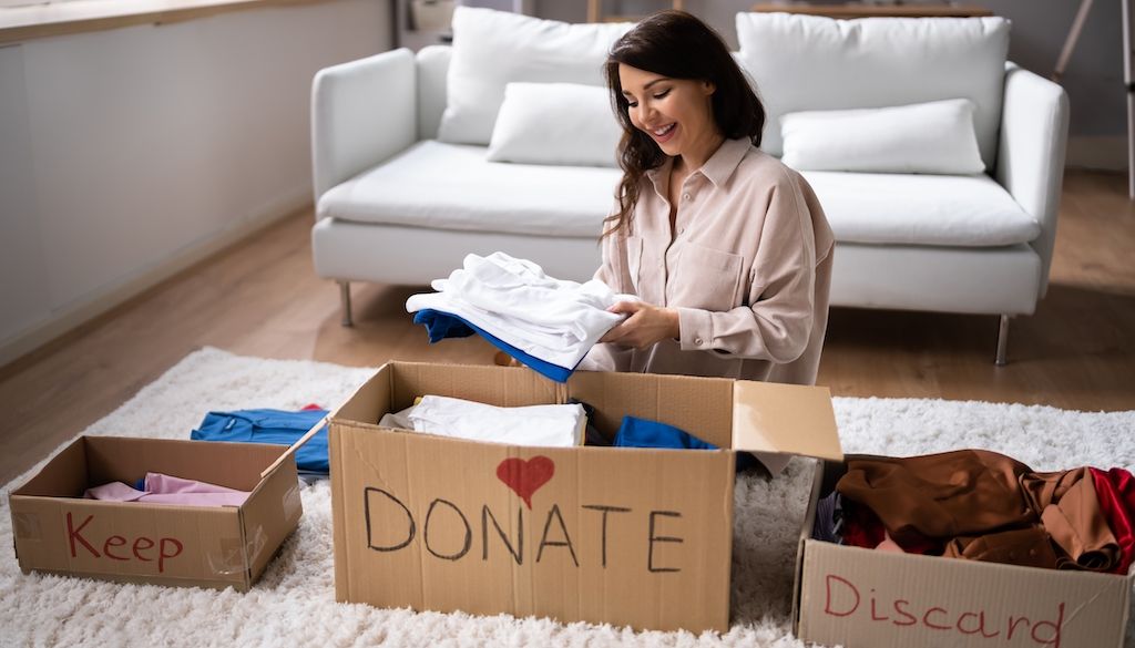 woman decluttering before a move