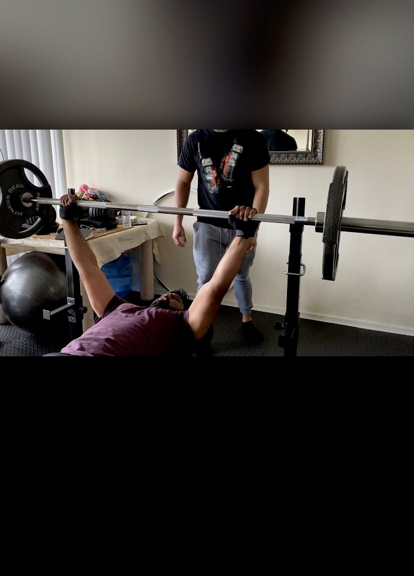 Training client in their home gym.