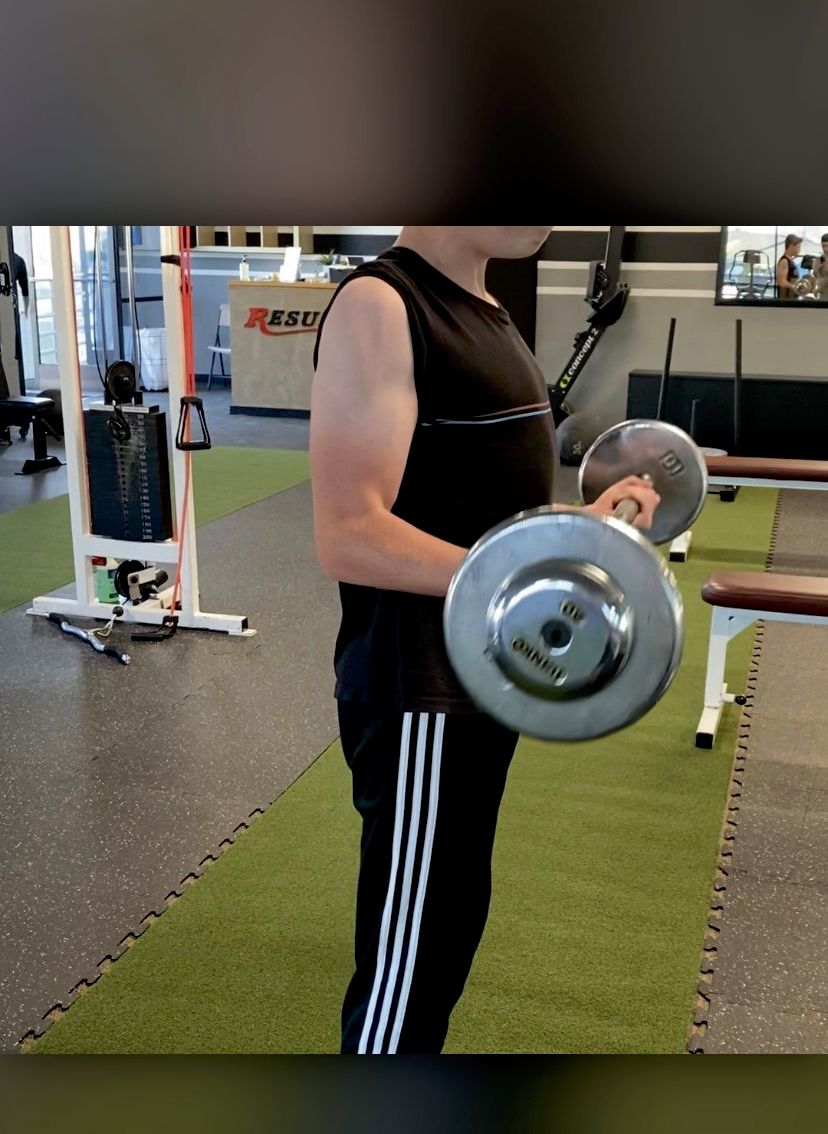 Zach(12) learning proper form when working out