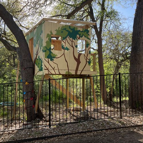 Eric painted a beautiful mural on a backyard treeh