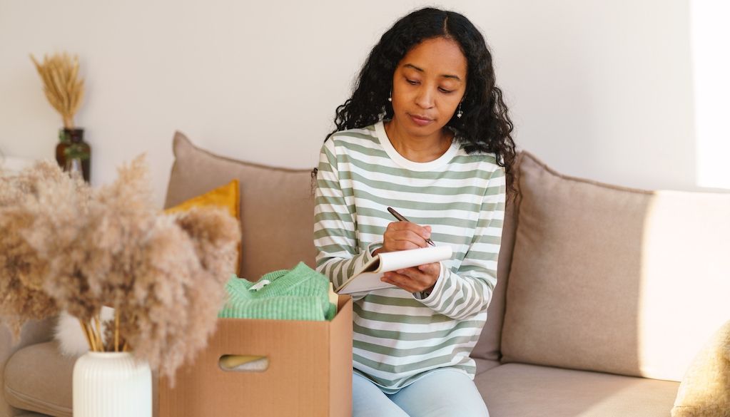 girl making a cross country moving checklist