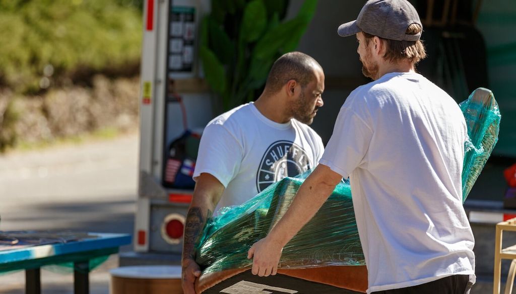 movers moving items in truck