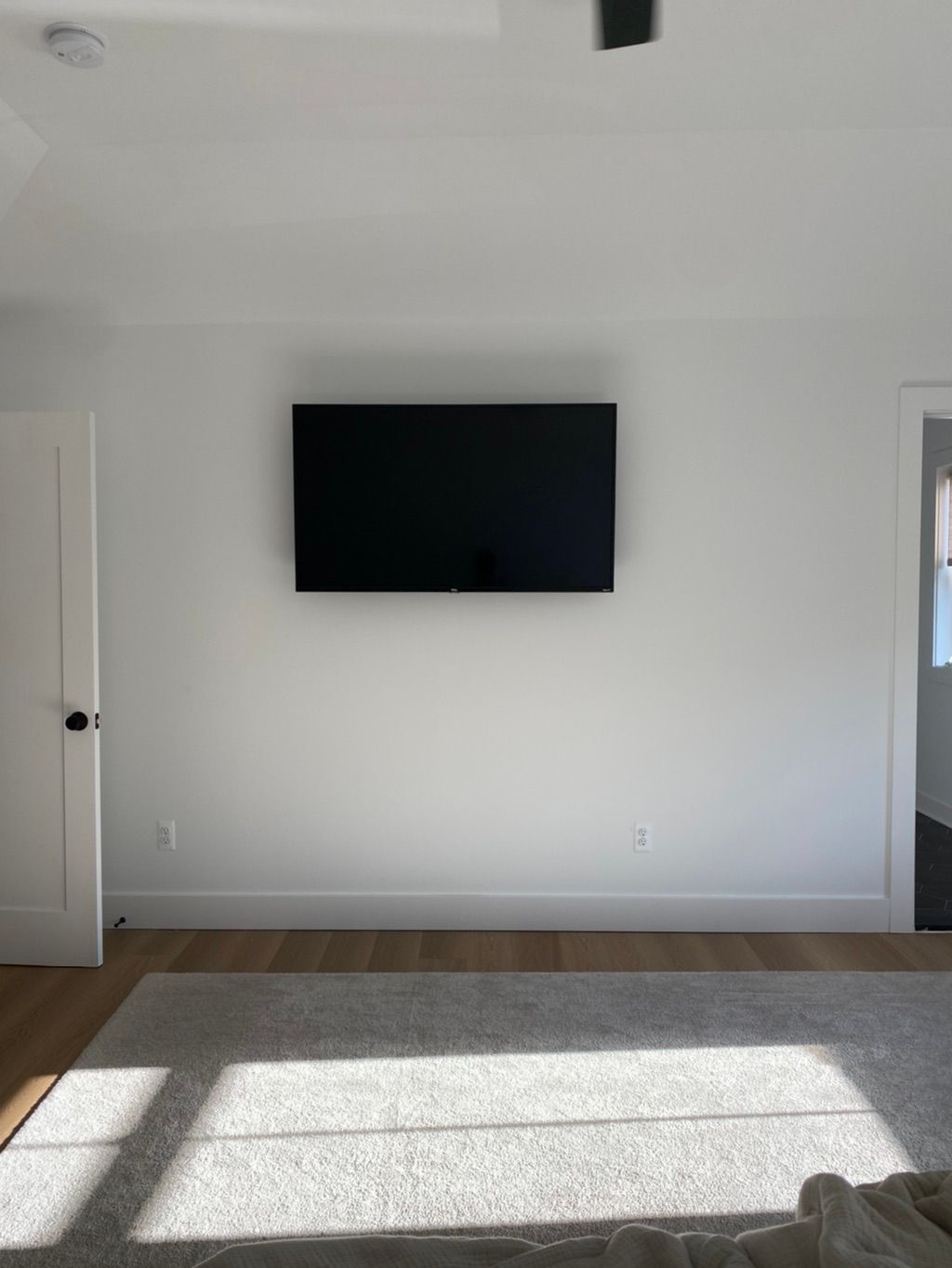 Wall mounted 55’ master bedroom TV 