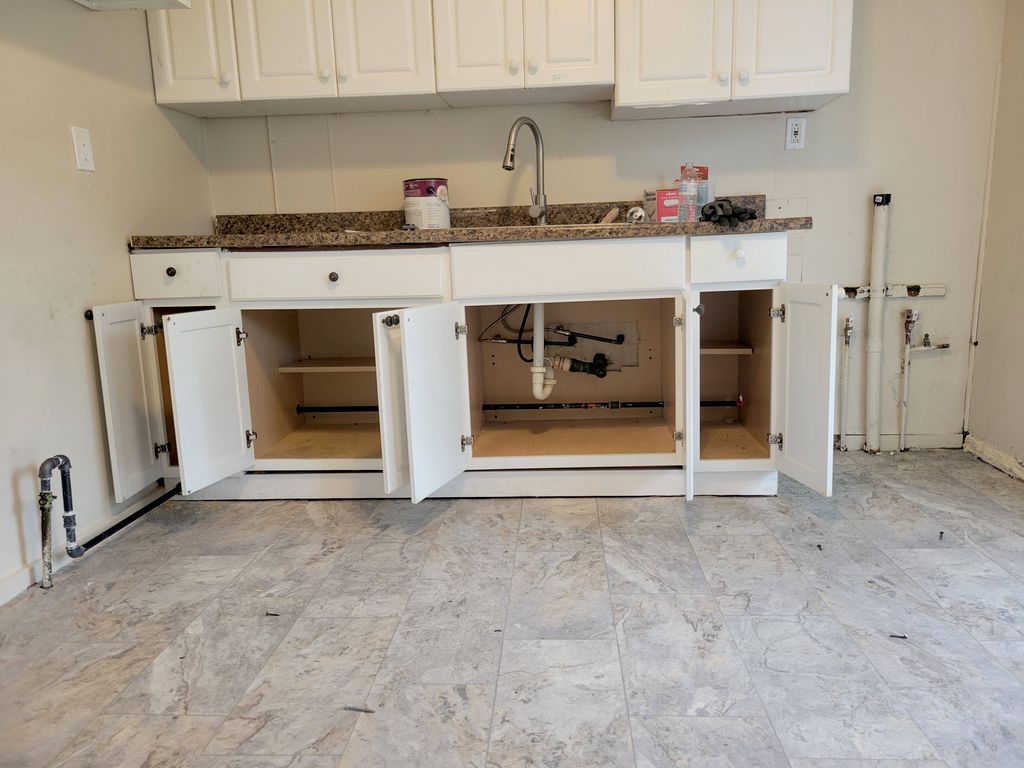 Gas line re-routed underneath kitchen cabinets