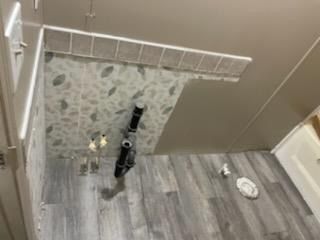 Plank Flooring install.  Guest Bath detail
