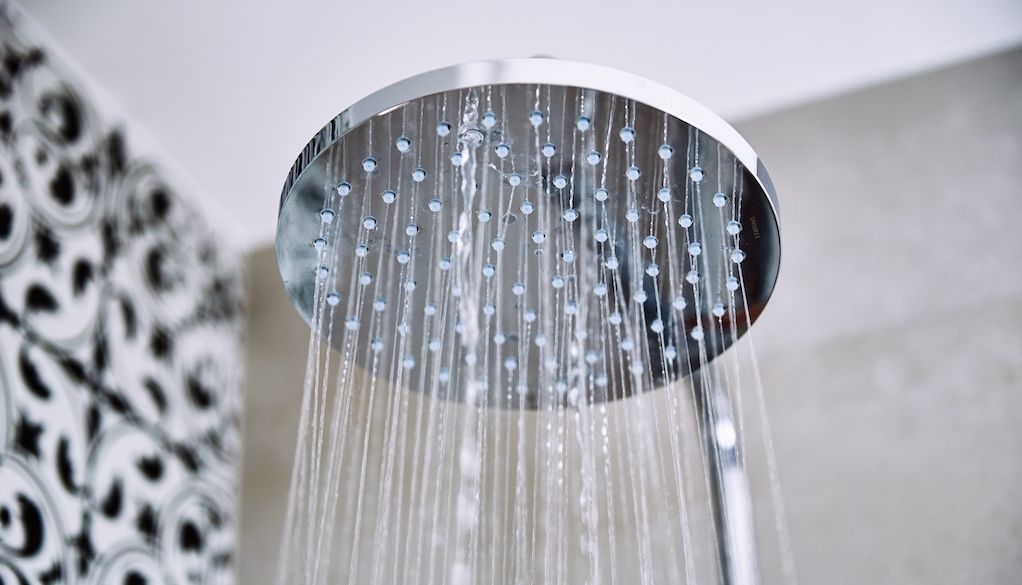 How to clean shower heads using vinegar and baking soda.