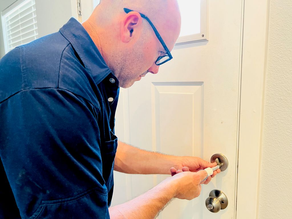 Installing a new front door lock for a customer