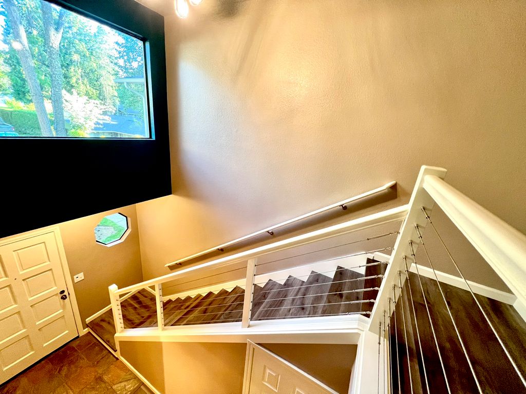 Full interior remodel. LVP flooring, cable stair r