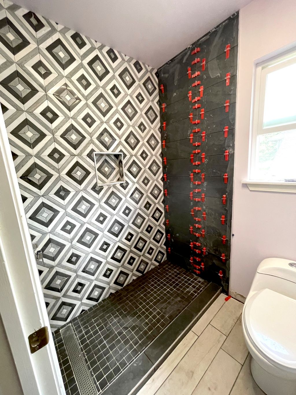 Converted a tub to walk-in shower. Detailed patter