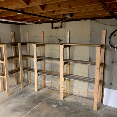 Storage shelves built from pallets and a few 2x4’s