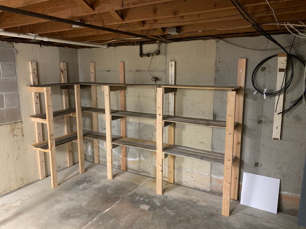 Storage shelves built from pallets and a few 2x4’s
