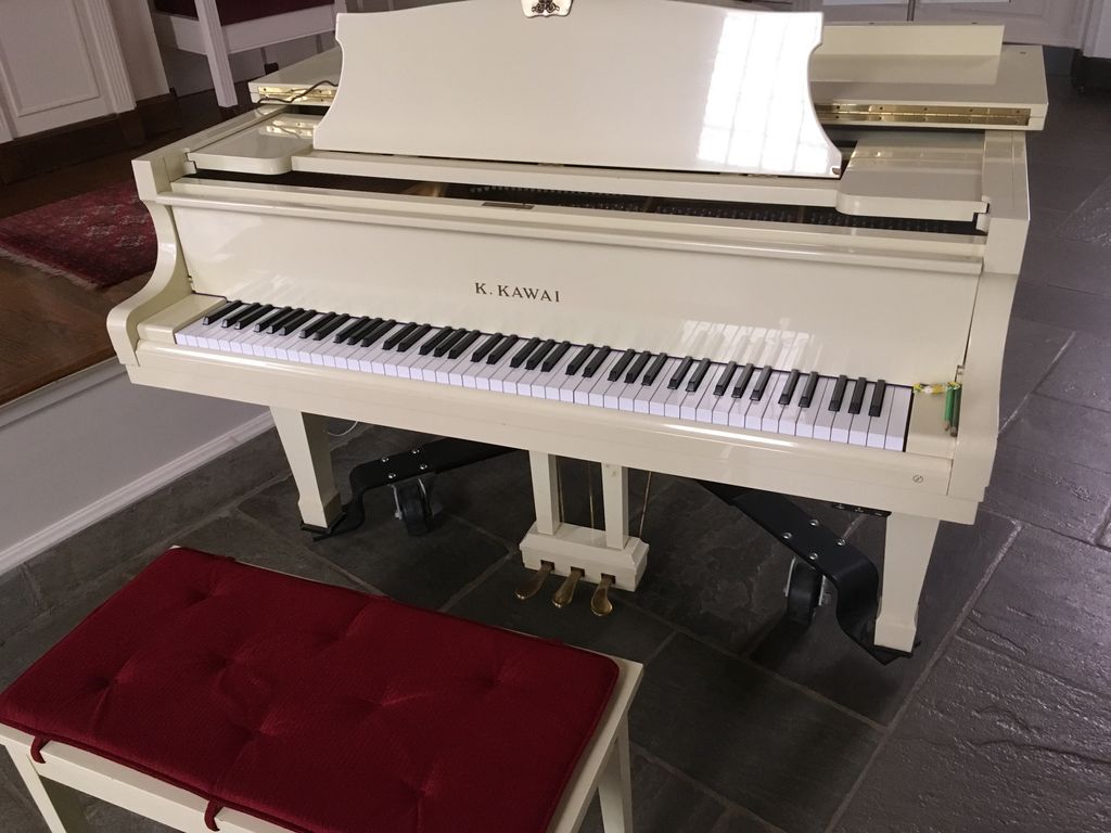 Tuning this beautiful baby grand before a French m
