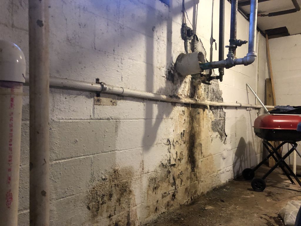 Misaligned pipes allowed sewage to back up into an