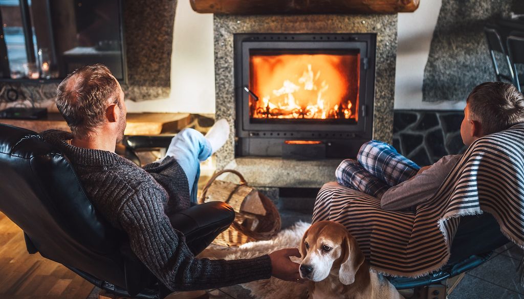 men in front of fireplace