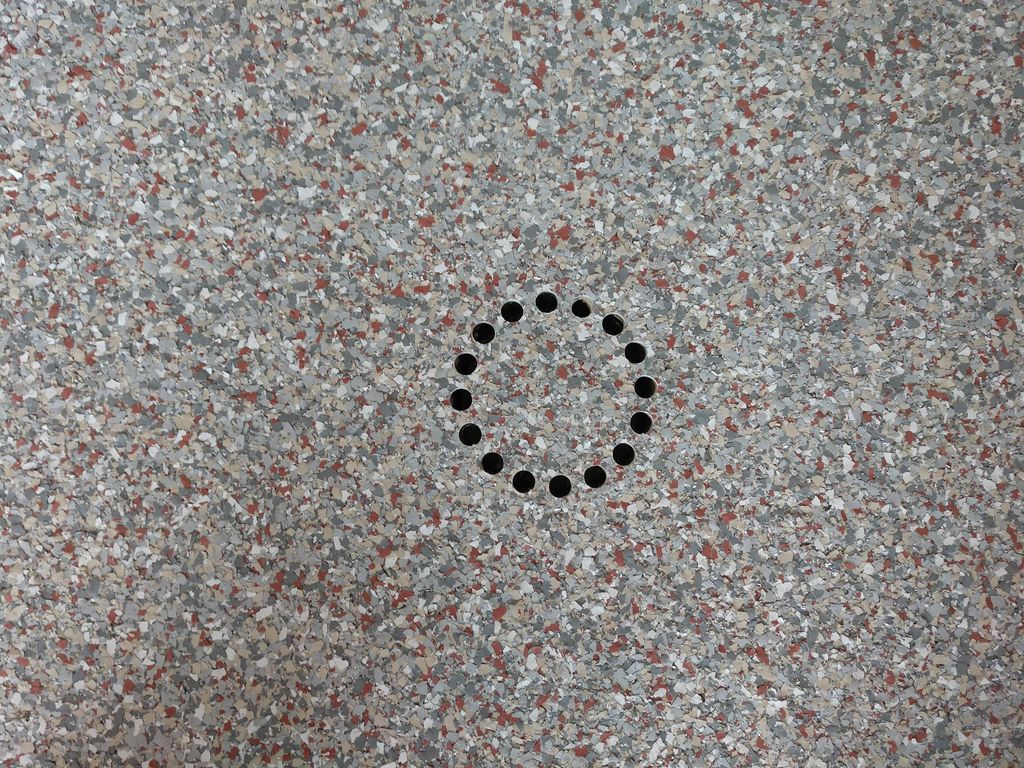 Detail work on garage floor drain.