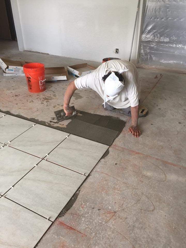Tile laying.