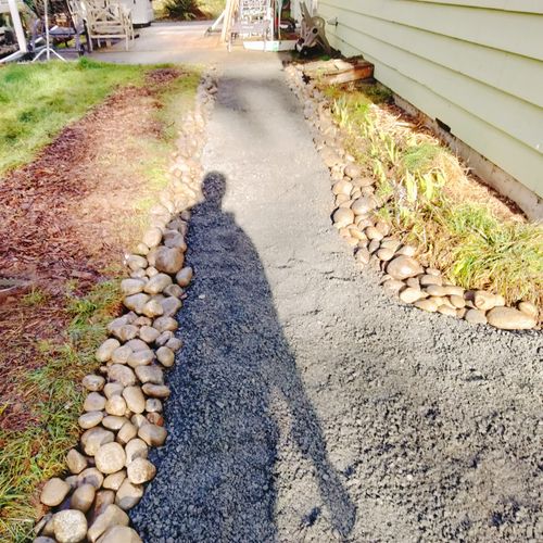 Gravel path with river cobble edging 