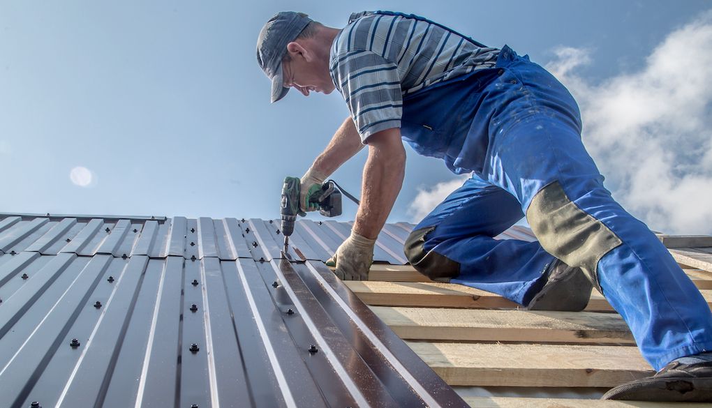 roof installing a metal roof