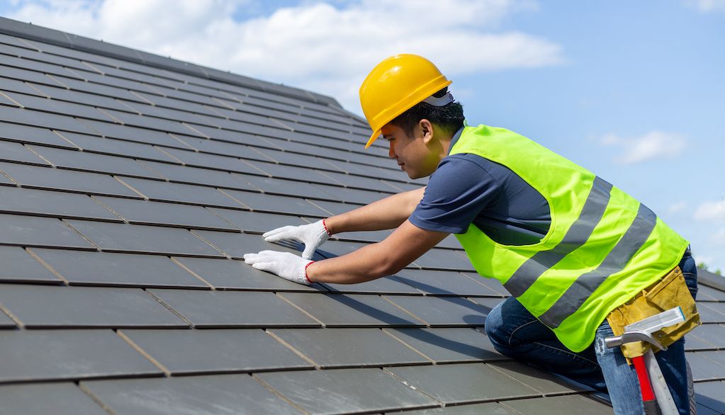 roofer on slate roof