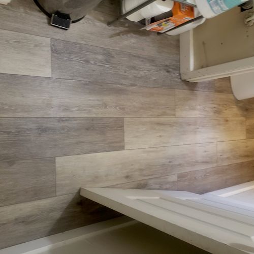 Awesome job. He installed flooring in both bathroo