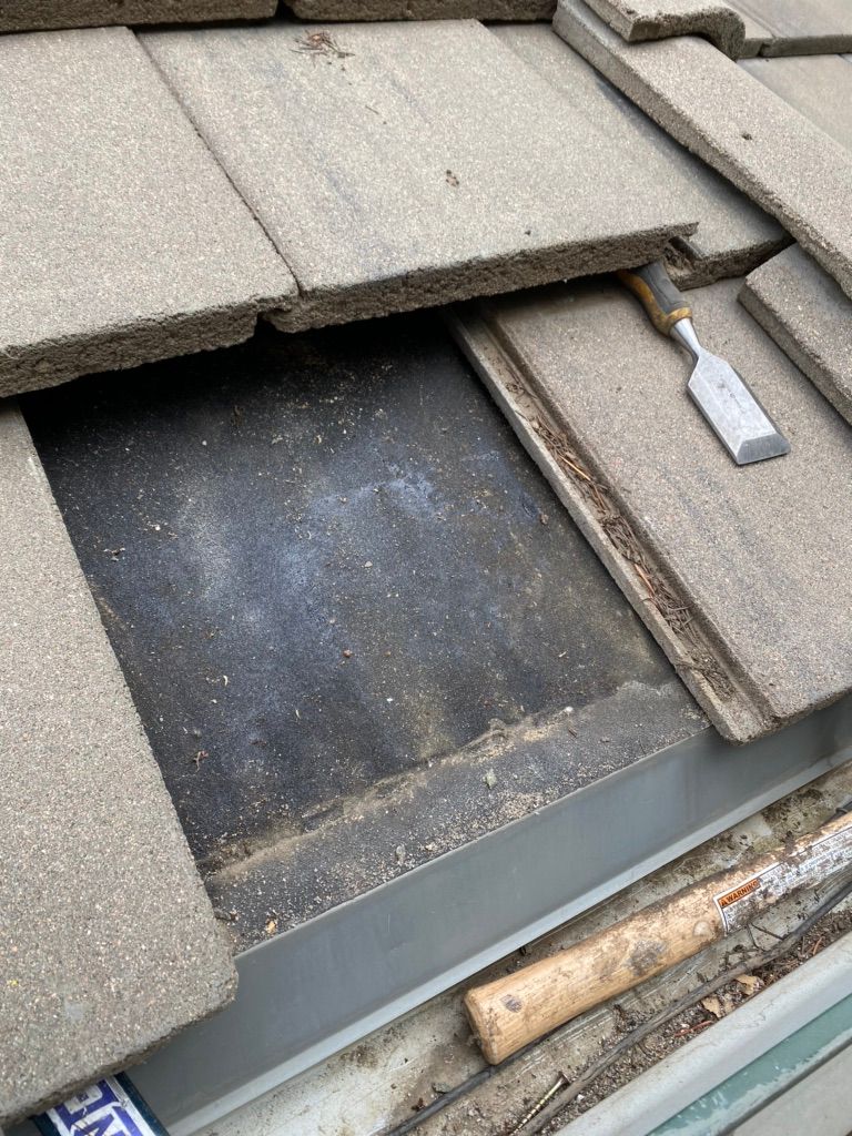Broke tile removed.