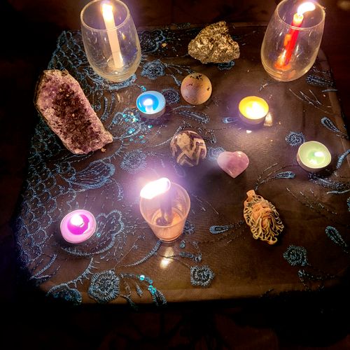 using crystals, candles and herbs to set frequenci