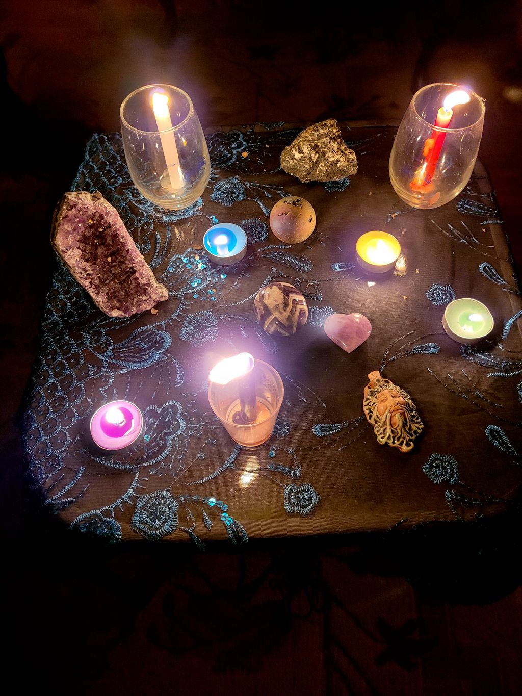 using crystals, candles and herbs to set frequenci