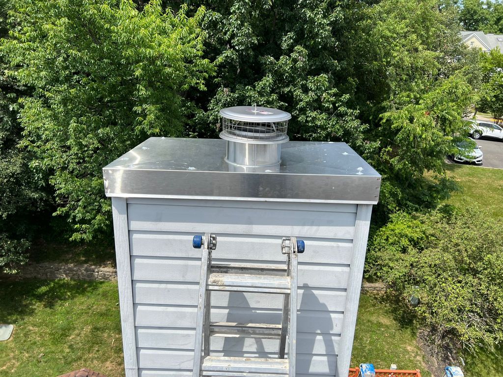 New stainless-steel chase cover and cap installed