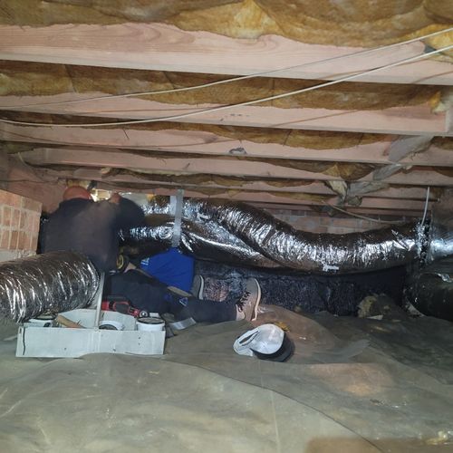 The team replacing ductwork. 