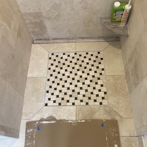 Custom stone mosaic shower floor