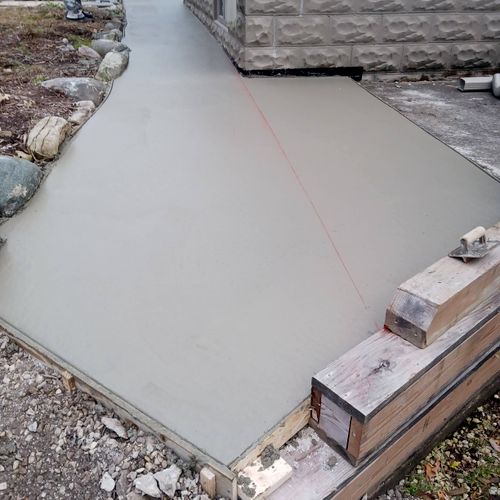 picture of poured concrete of sidewalk and ramp