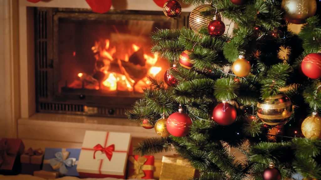 Christmas tree by the fireplace