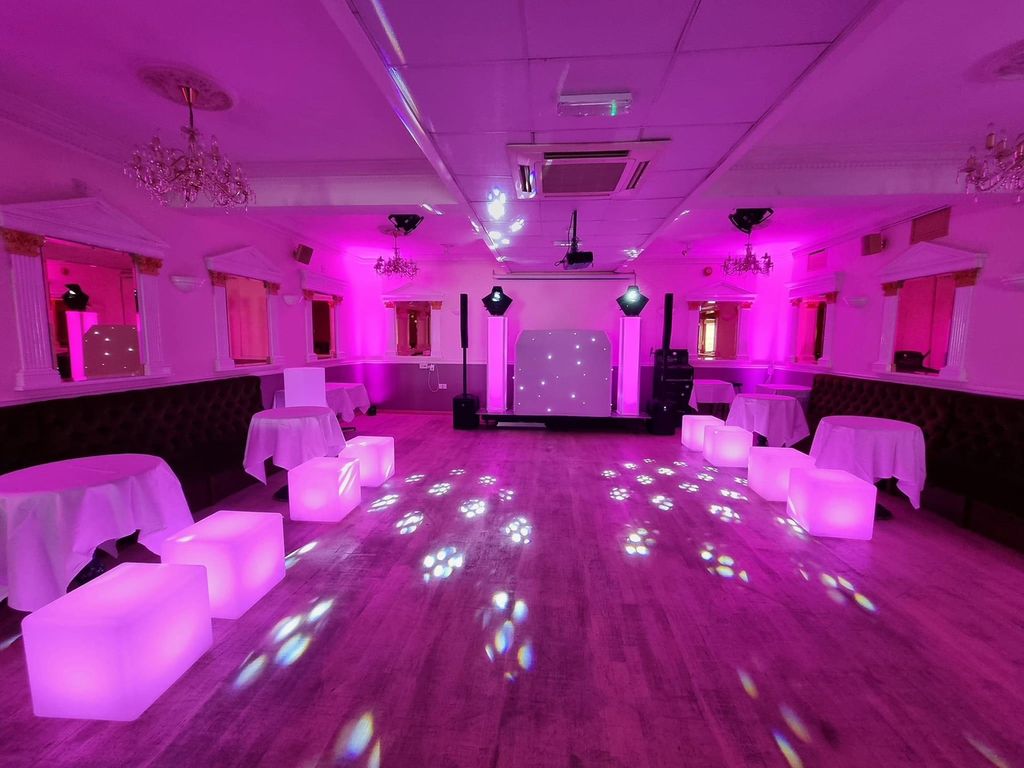 Sweet 16 party setup w/ pink lighting 