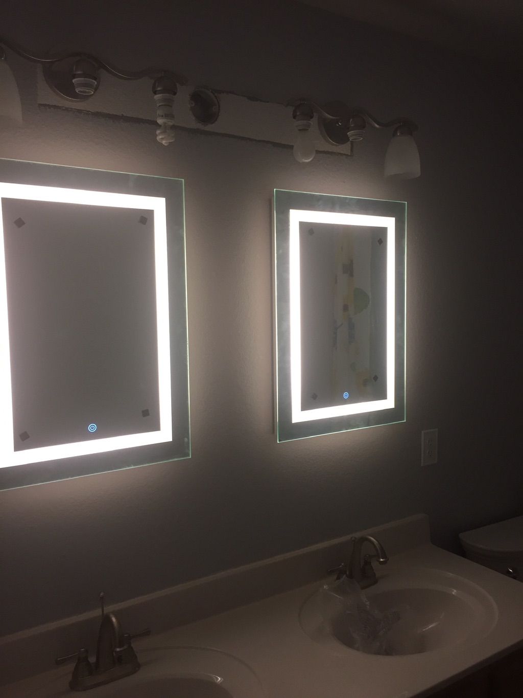 Installed two LED touch mirrors in restroom for cu